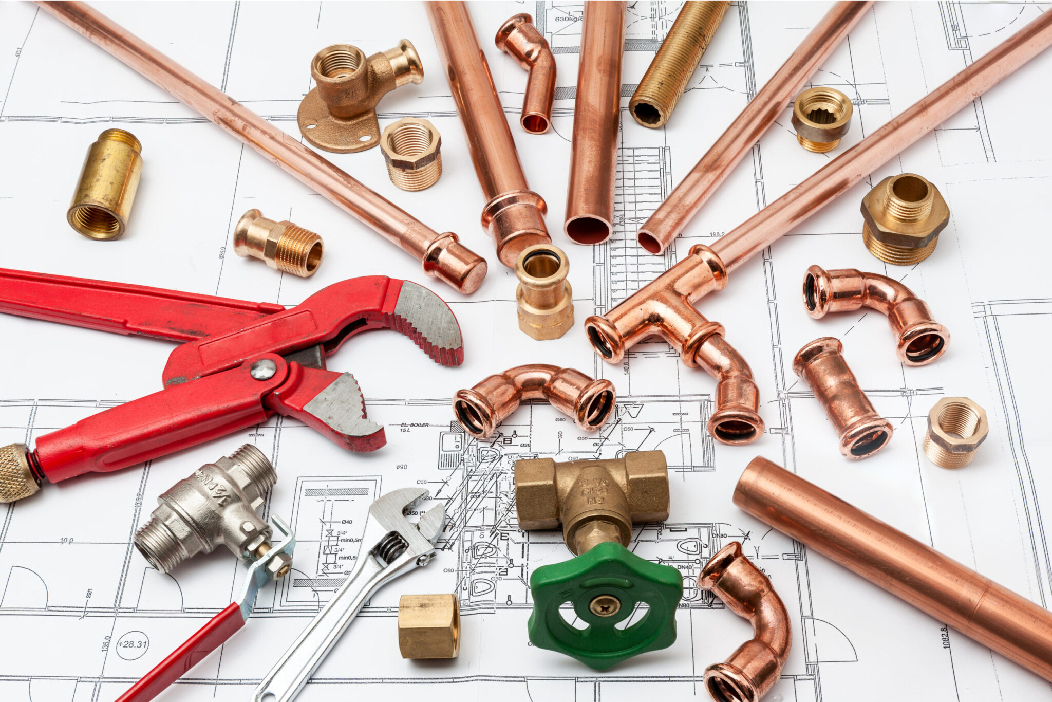 Plumbing,Tools,Arranged,On,House,Plans,Whit,Wrench,And,Pipe